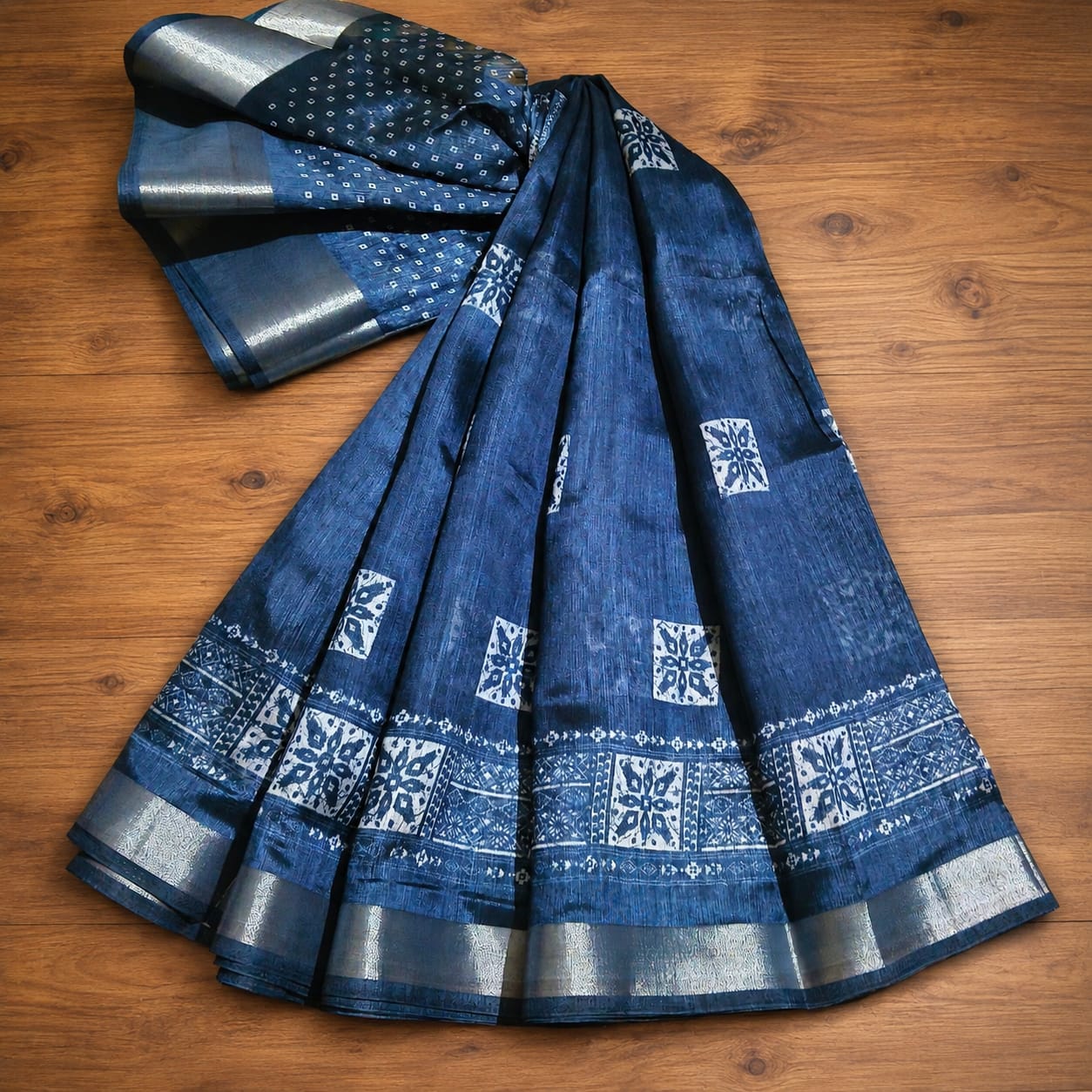 Stunning deep blue Weave Kala Indigo Akola Kota Doria sari features intricate hand block printing and a shimmering silver zari border