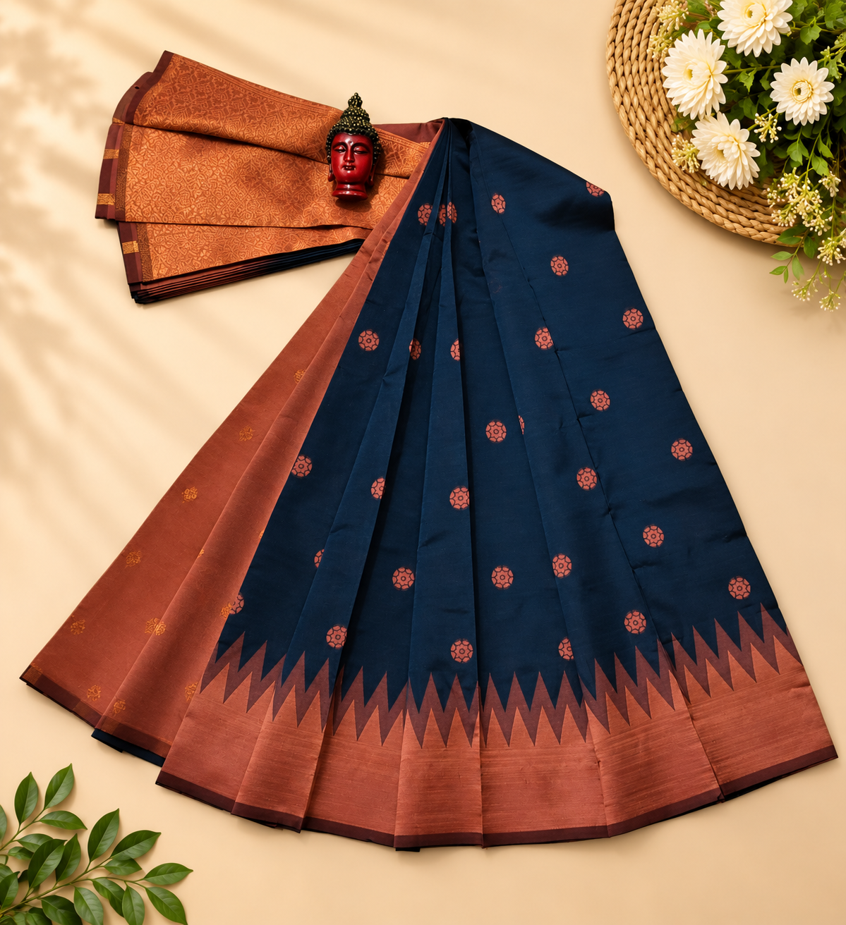Stunning peacock blue and maroon Banarasi soft silk saree that features an intricately woven golden floral butta pattern and a contrasting maroon zari border.