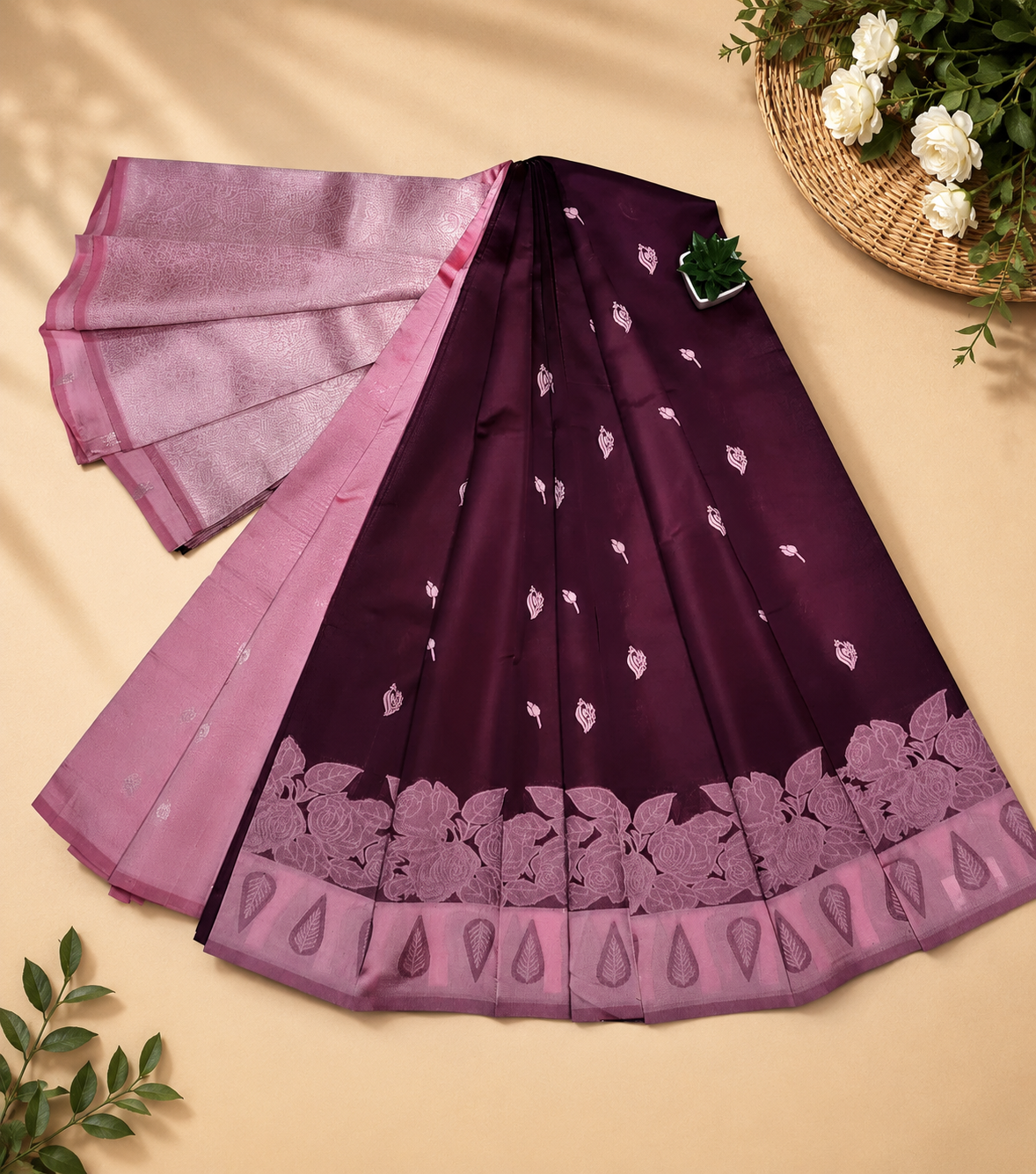 This elegant deep purple Banarasi silk saree features intricate woven Zari motifs and a contrasting dark purple border with delicate floral patterns.